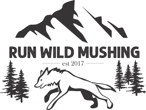 Logo with a running dog, mountains, trees, and 'Run Wild Mushing est 2017' text.